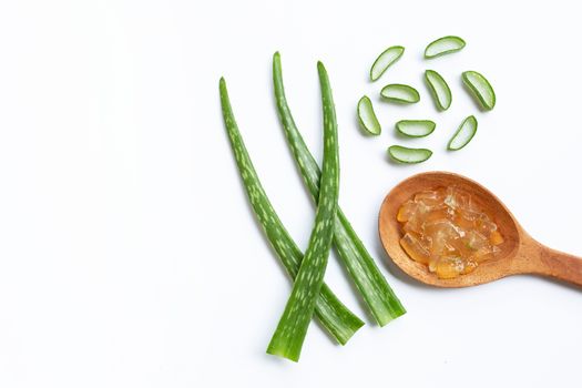 Aloe vera gel on wooden spoon with aloe vera on white background
