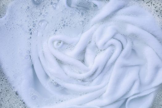 Soak a cloth before washing, white cloth
