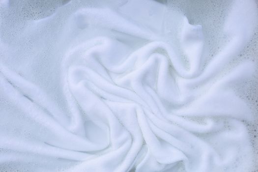 Soak a cloth before washing, white cloth