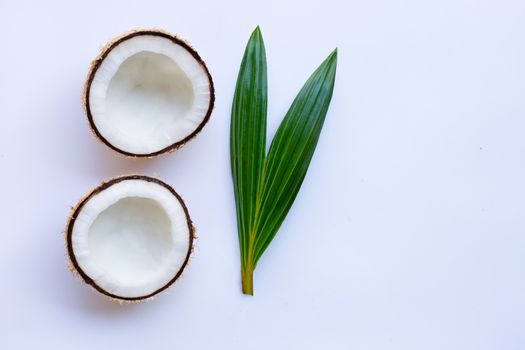 Coconut with leaf on white background.