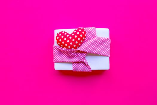 Valentine's day with gift box  on pink background. Copy space