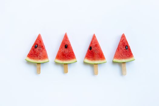 Sweet watermelon slice popsicles on white background