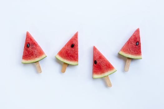 Sweet watermelon slice popsicles on white background