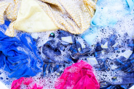 Washing clothes, colorful clothes soaked.