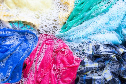 Washing clothes, colorful clothes soaked.