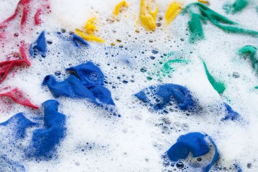Washing clothes, colorful clothes soaked.