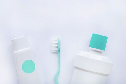 Toothbrush and toothpaste with bottle of  Mouthwash on white background.