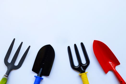Garden shovel and fork isolated on white background