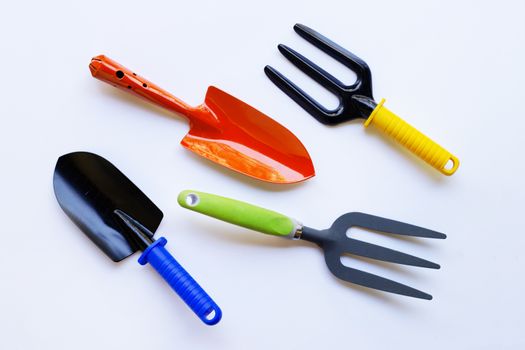 Garden shovel and fork isolated on white background