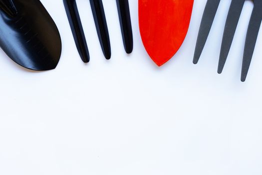 Garden shovel and fork isolated on white background