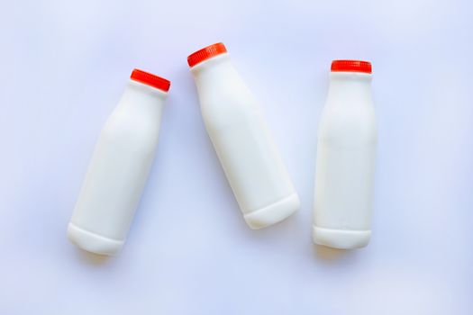 milk bottle on over white background