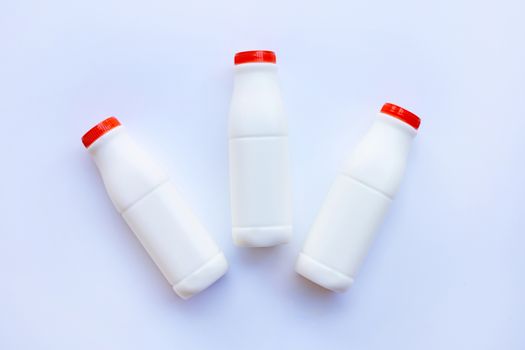 milk bottle on over white background