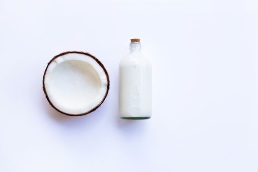 Coconut with coconut milk on white background. Copy space