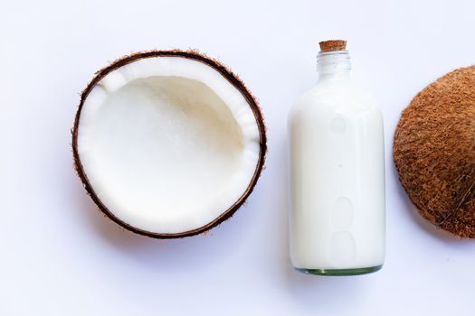 Coconut with coconut milk on white background