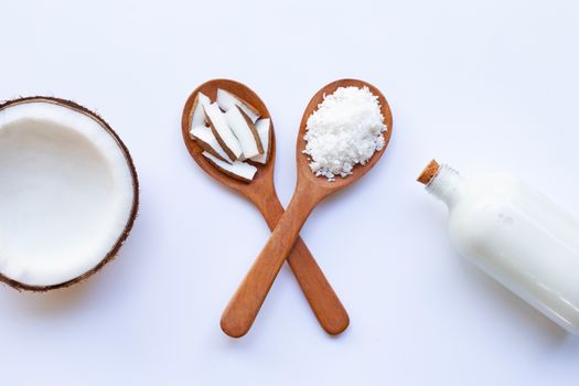 Half Coconut with coconut milk on white background.