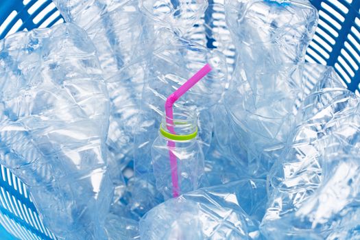 Plastic bottles in waste basket.
