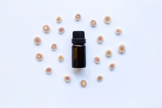 Lemon grass essential oil with  sliced fresh Lemon grass on white background