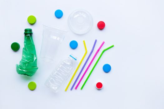 Plastic waste on white background. Top view