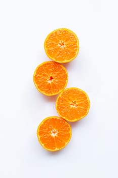 Orange fruits on a white background. Top view