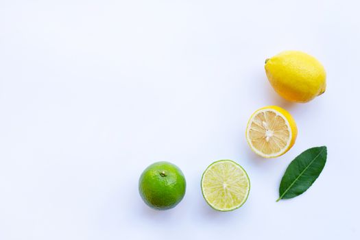 Ripe lemons and limes on white background.