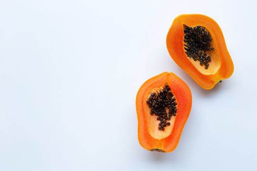 Slices of papaya fruit on a white background. Copy space