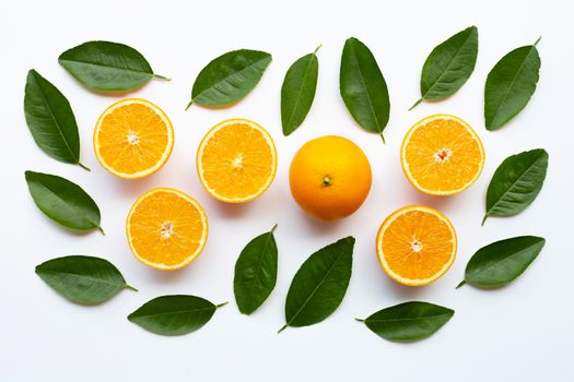 Fresh orange with green leaves on white background. Top view