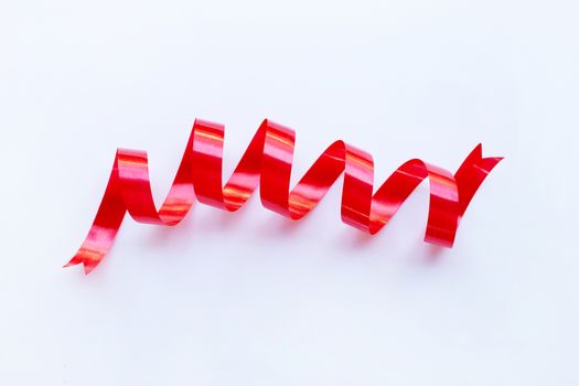Red ribbon on white background. Copy space