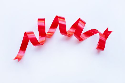 Red ribbon on white background. Copy space