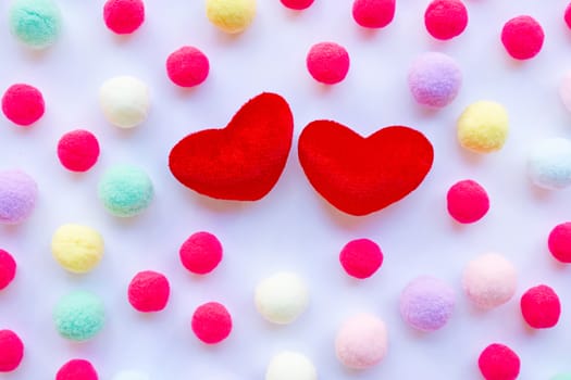 Red hearts, little colorful balls . Concept of Valentines Day on white background
