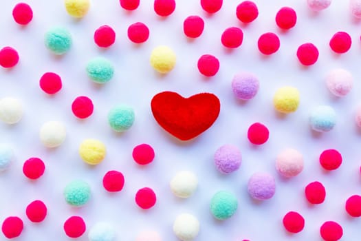 Red heart, little colorful balls . Concept of Valentines Day on white background