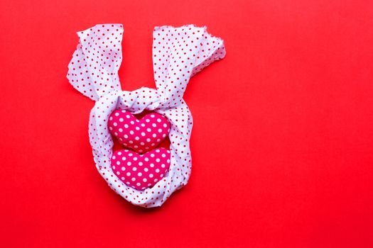 Valentine's hearts on red background, Top view with copy space