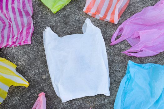 Plastic bags on cement floor background.