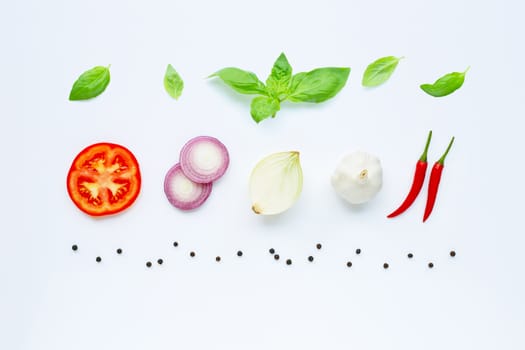 Various fresh vegetables and herbs on white. Healthy eating concept.