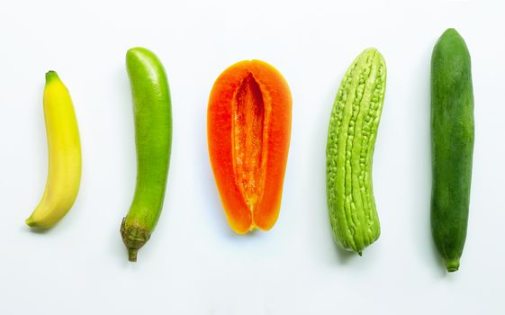 Banana, green long eggplant, ripe papaya, bitter melon,  green papaya on white background. Sex concept