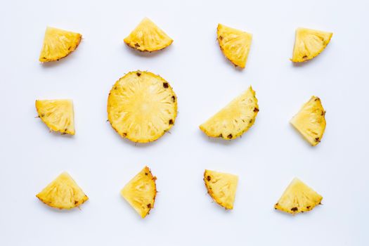 Pineapple slices on white background.
