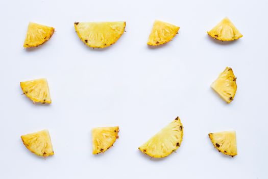Pineapple slices on white background. Copy space