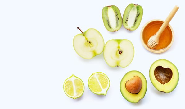 Avocado, green apple, kiwi, lime. Natural ingredients for homemade skin care on white background. Copy space