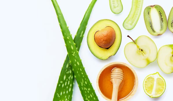 Natural ingredients for homemade skin care on white background.