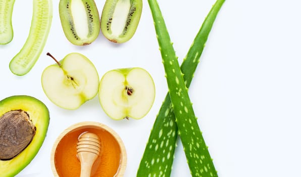 Natural ingredients for homemade skin care on white background.