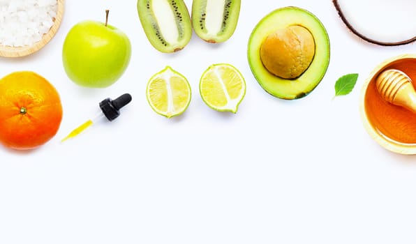 Natural ingredients for homemade skin care on white background.