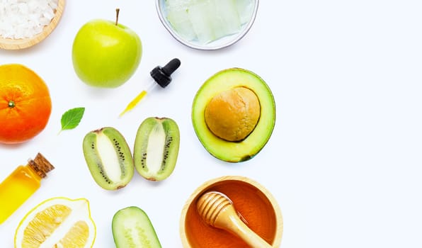 Natural ingredients for homemade skin care on white background.