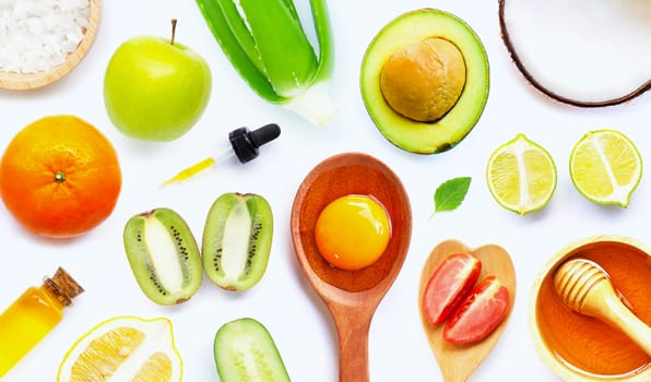 Natural ingredients for homemade skin care on white background.