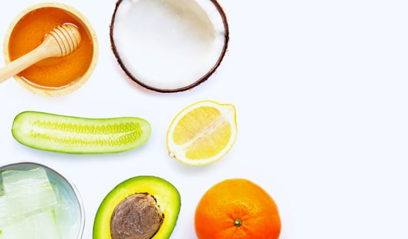 Natural ingredients for homemade skin care on white background.
