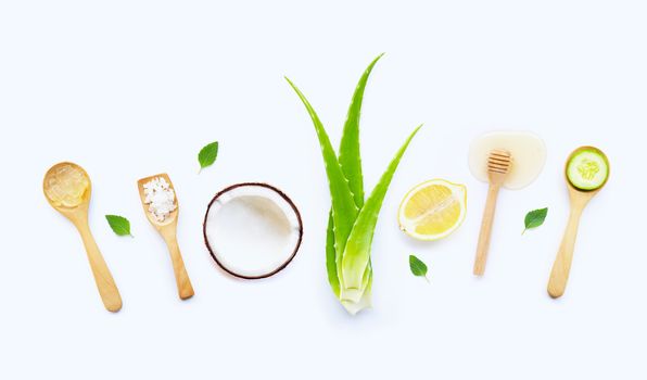 Natural ingredients for homemade skin care on white background.