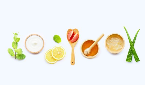 Natural ingredients for homemade skin care on white