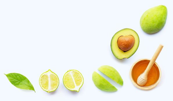 Avocado with honey on white background. Top view, Copy space