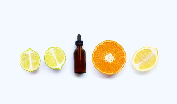 Essential oil with citrus tropical fruit isolated on white background