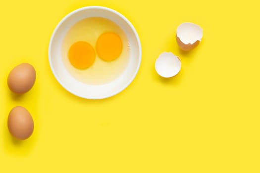 Eggs on yellow background. Top view