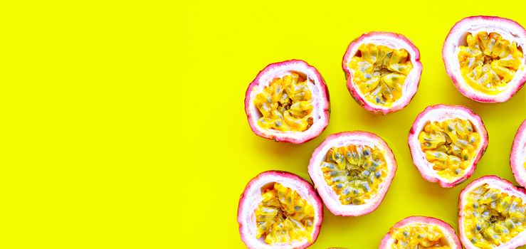 Passion fruit on yellow background.  Copy space