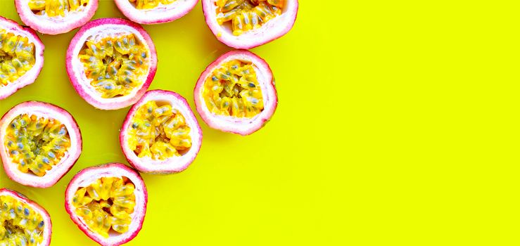 Passion fruit on yellow background.  Copy space